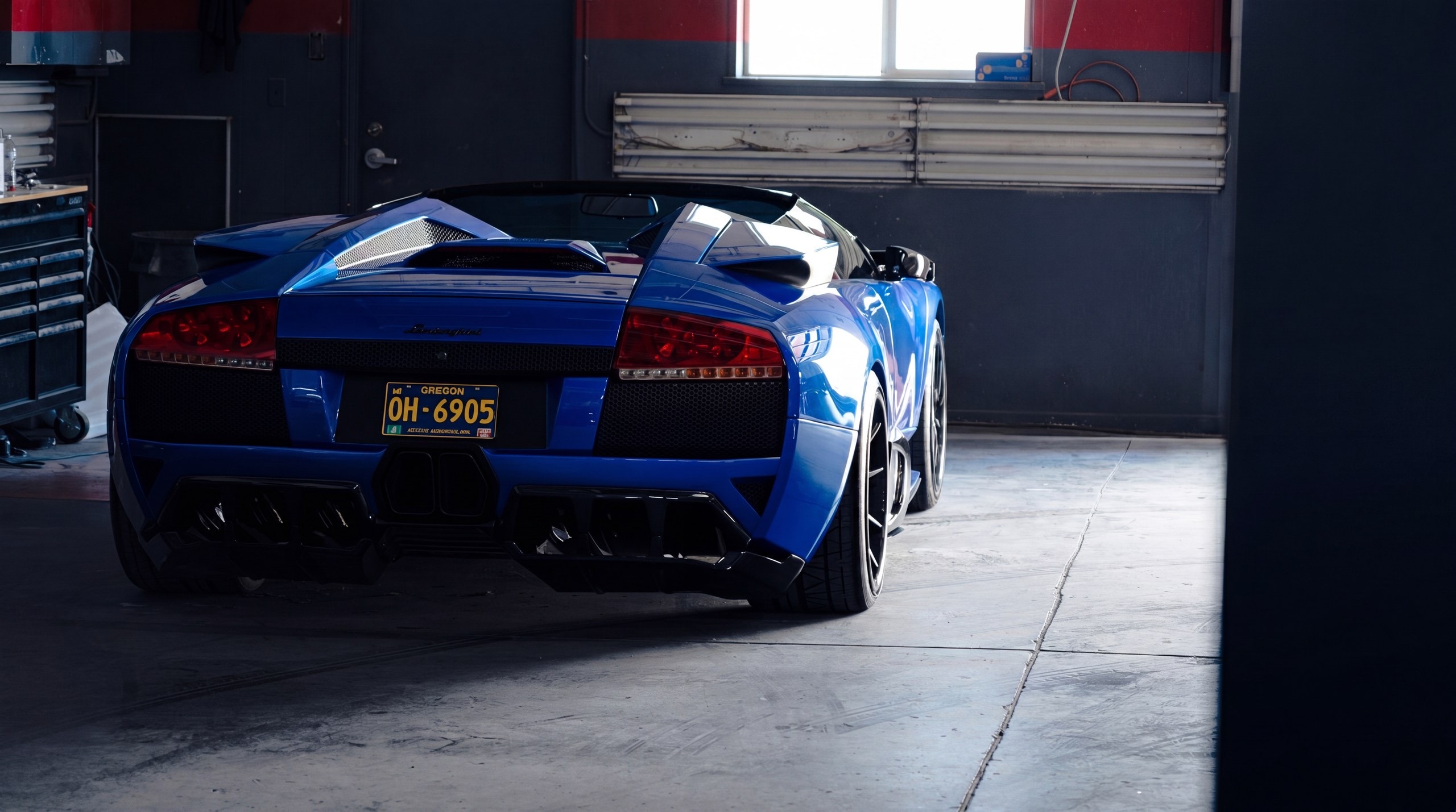A blue Lamborghini Murcielago in the Alpina Auto Body service bay in Southeast Portland