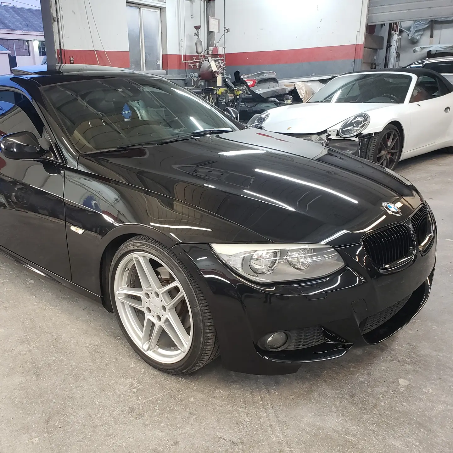 The same BMW 3 Series coupe after collision repair and refinishing at Alpina, front end restored
